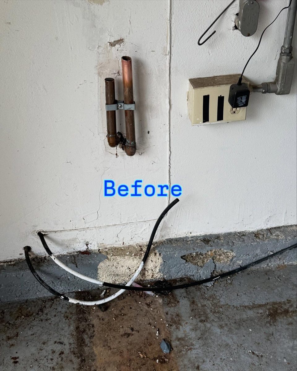 Before: original copper water lines on a garage wall prior to a whole-house water filtration installation in the San Gabriel Valley